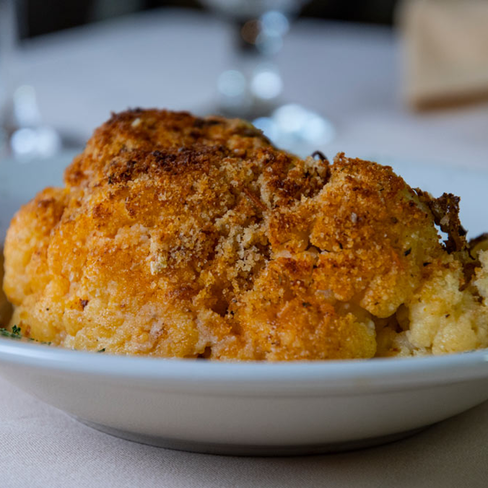 Baked cauliflower with a golden breadcrumb topping