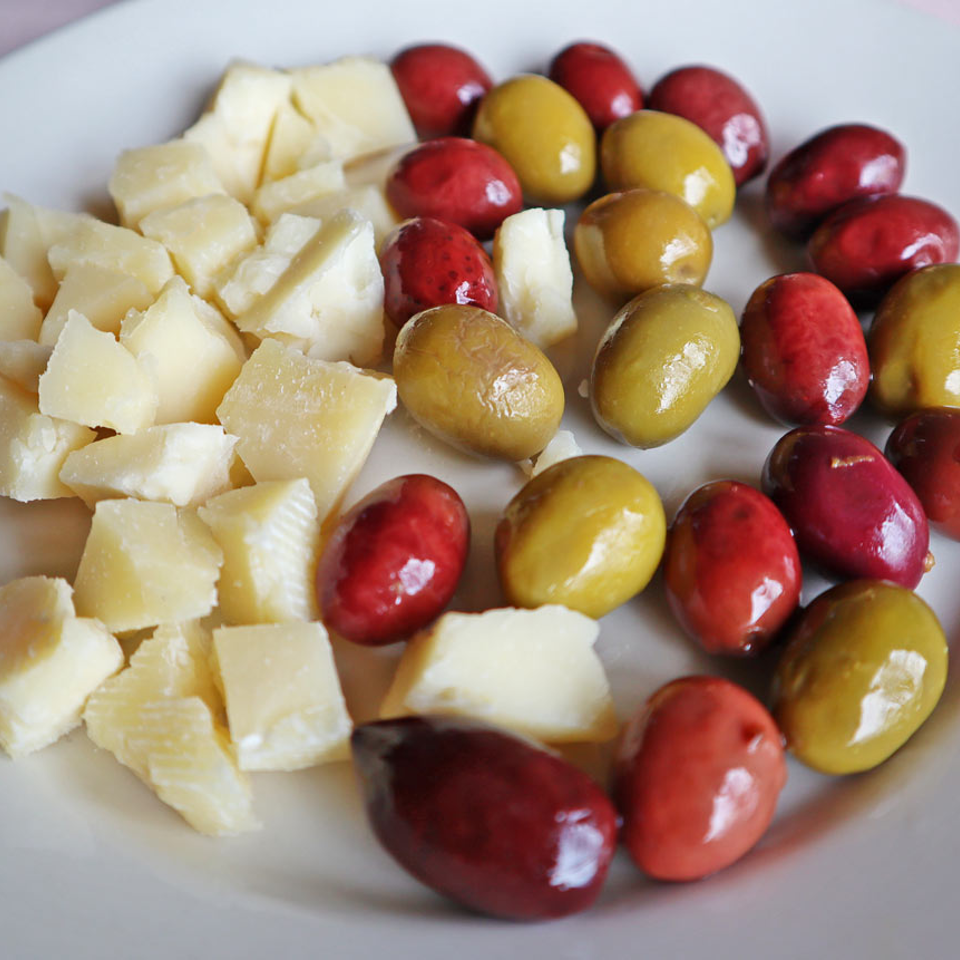 Plate of cheese and mixed olives