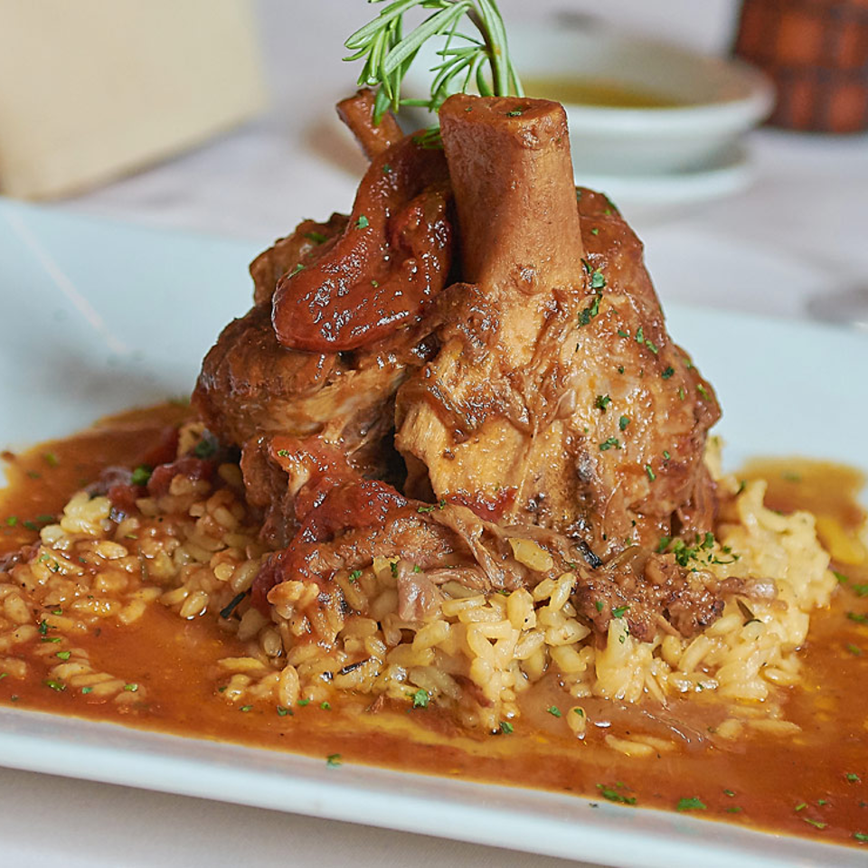 Braised shank served over risotto