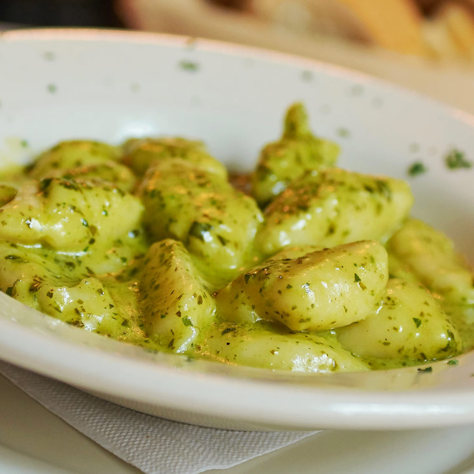 Gnocchi in a green pesto cream sauce