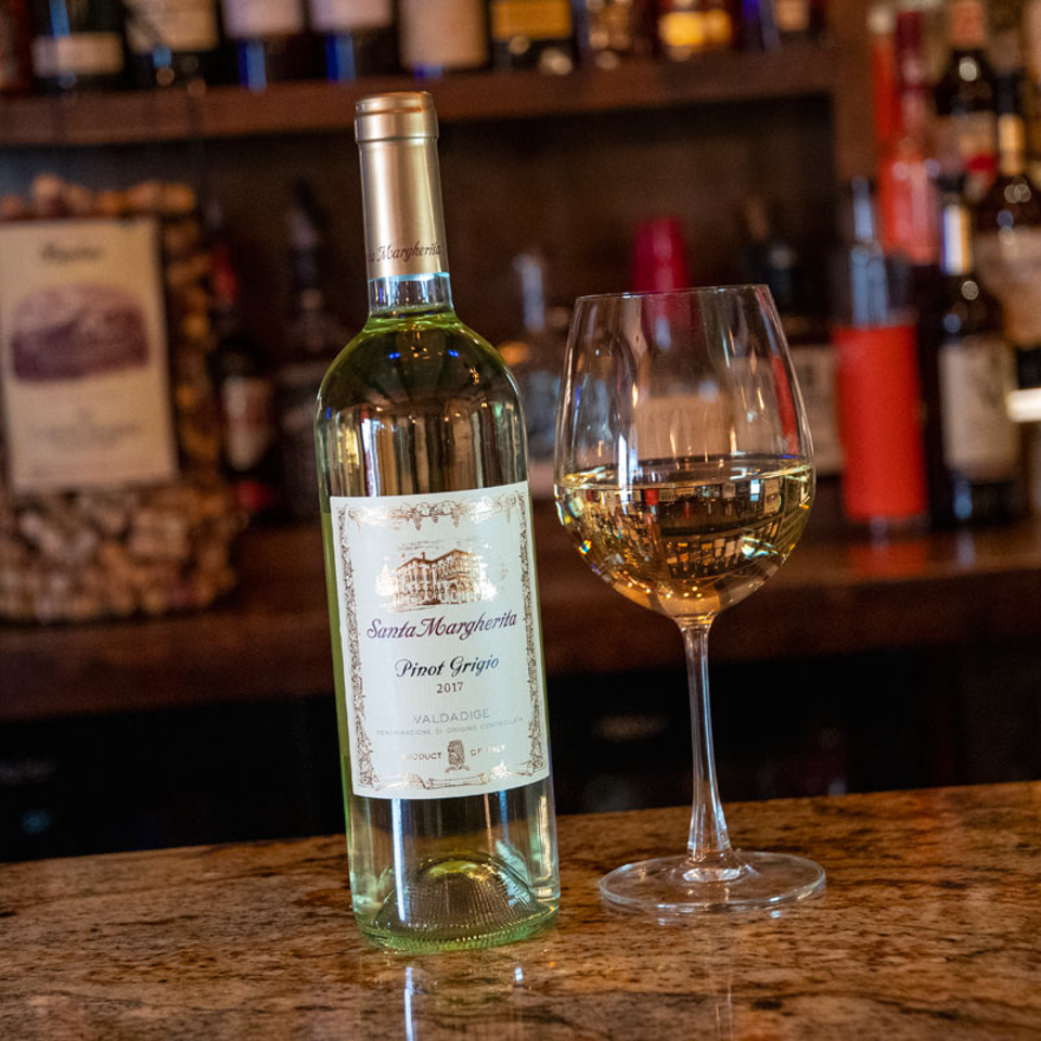 Pinot Grigio bottle and glass at the bar