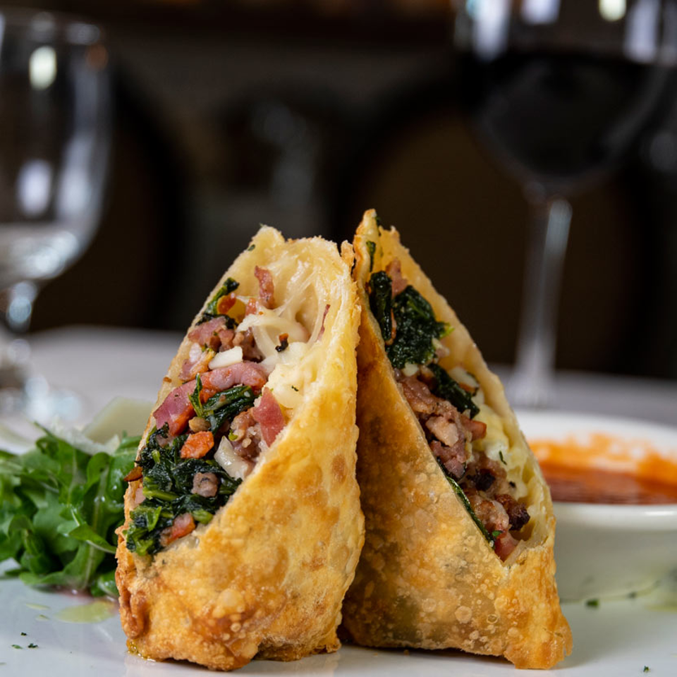 Savory fried rolls with greens and dipping sauce