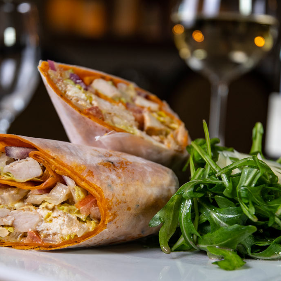 Chicken wrap with a side of arugula